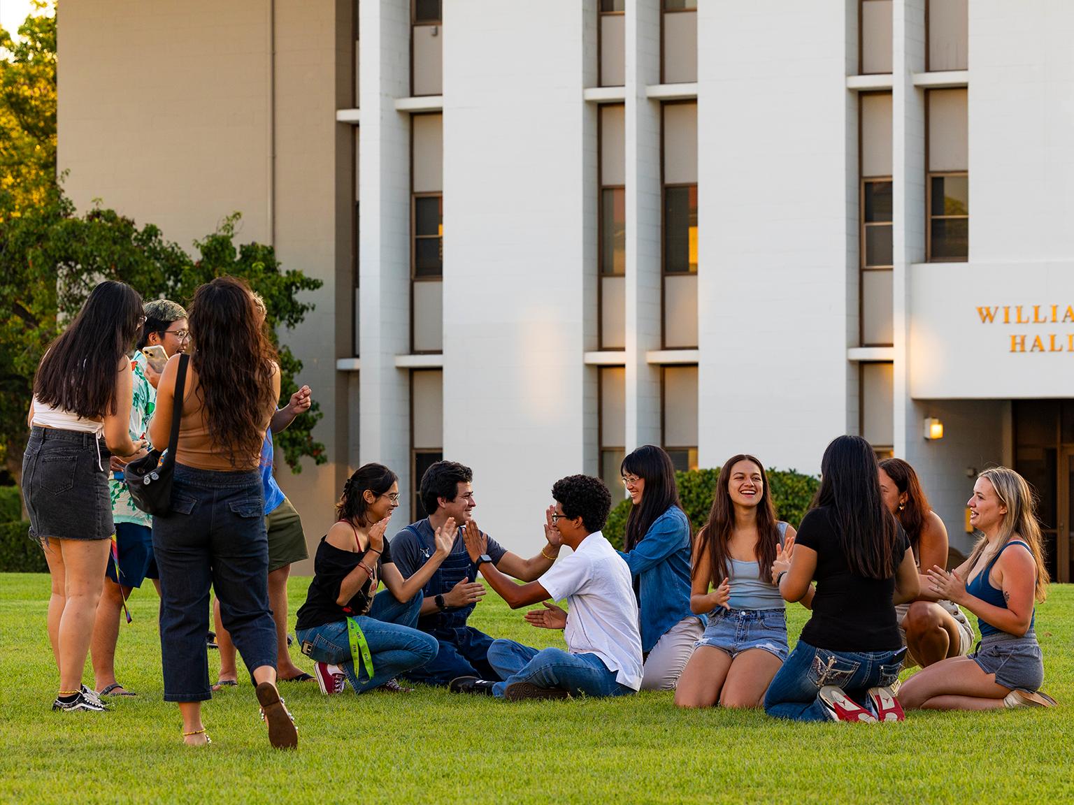 First-year students on grass outside of Williams Hall.